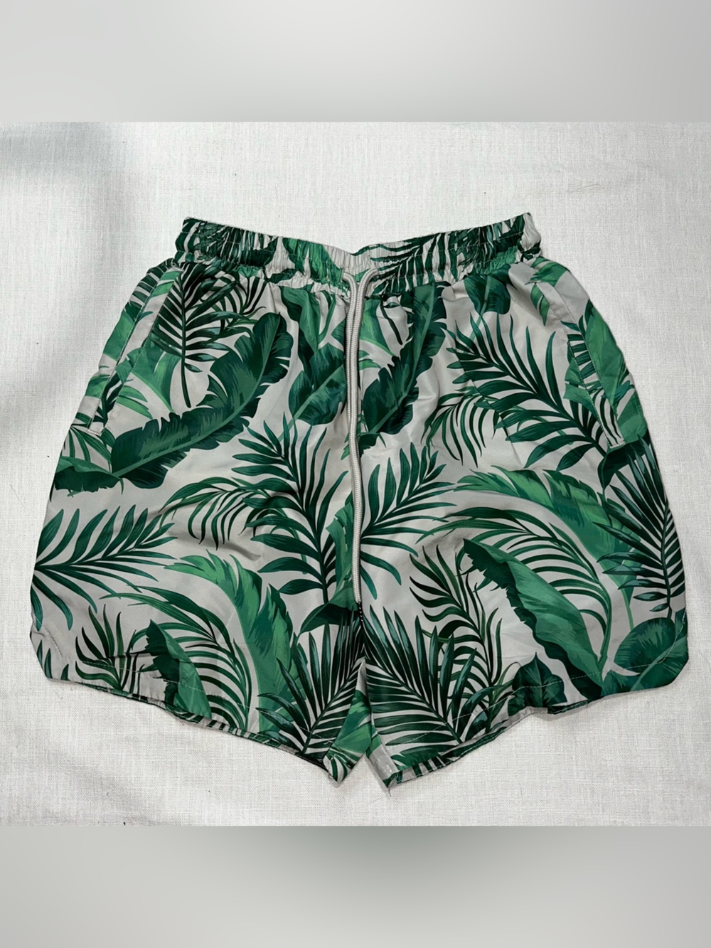 White Athletic Shorts with Green Tropical Leaf Print